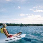 Kayaker in front of Mariti Hotel by Tim Parkinson